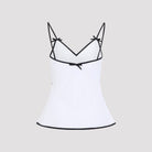 White Moschino sleeveless top showing flared hem detail