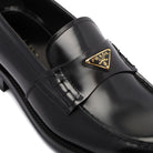 BRUSHED LEATHER LOAFERS Prada