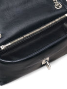 Black leather Marc Jacobs mini bag, side profile showing chain strap