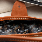 Black Goyard Artois PM tote bag interior showing slip pocket