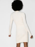 Beige Wolford mini dress with long sleeves, side angle view