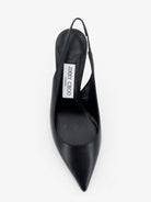 Black Jimmy Choo slingback pump showing suede sole and logo insole detail