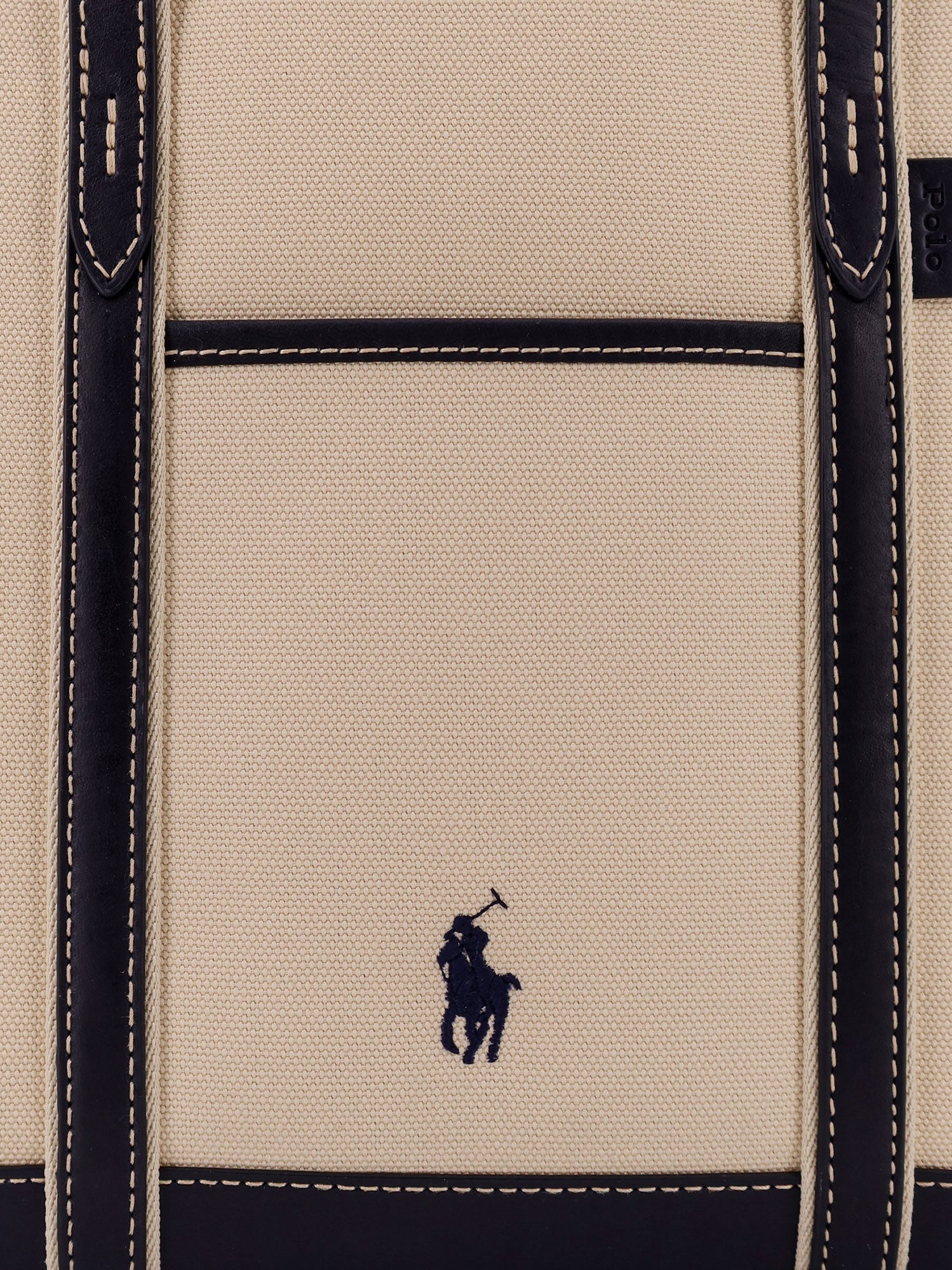 Beige canvas shoulder bag by Polo Ralph Lauren, open-top view showing interior