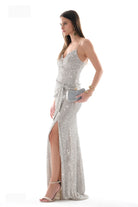 Silver beaded gown on model showing thigh-high slit and floor-length hem