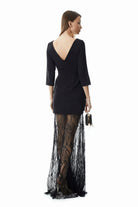 Black mini bodice gown with floor-length lace overlay, three-quarter view