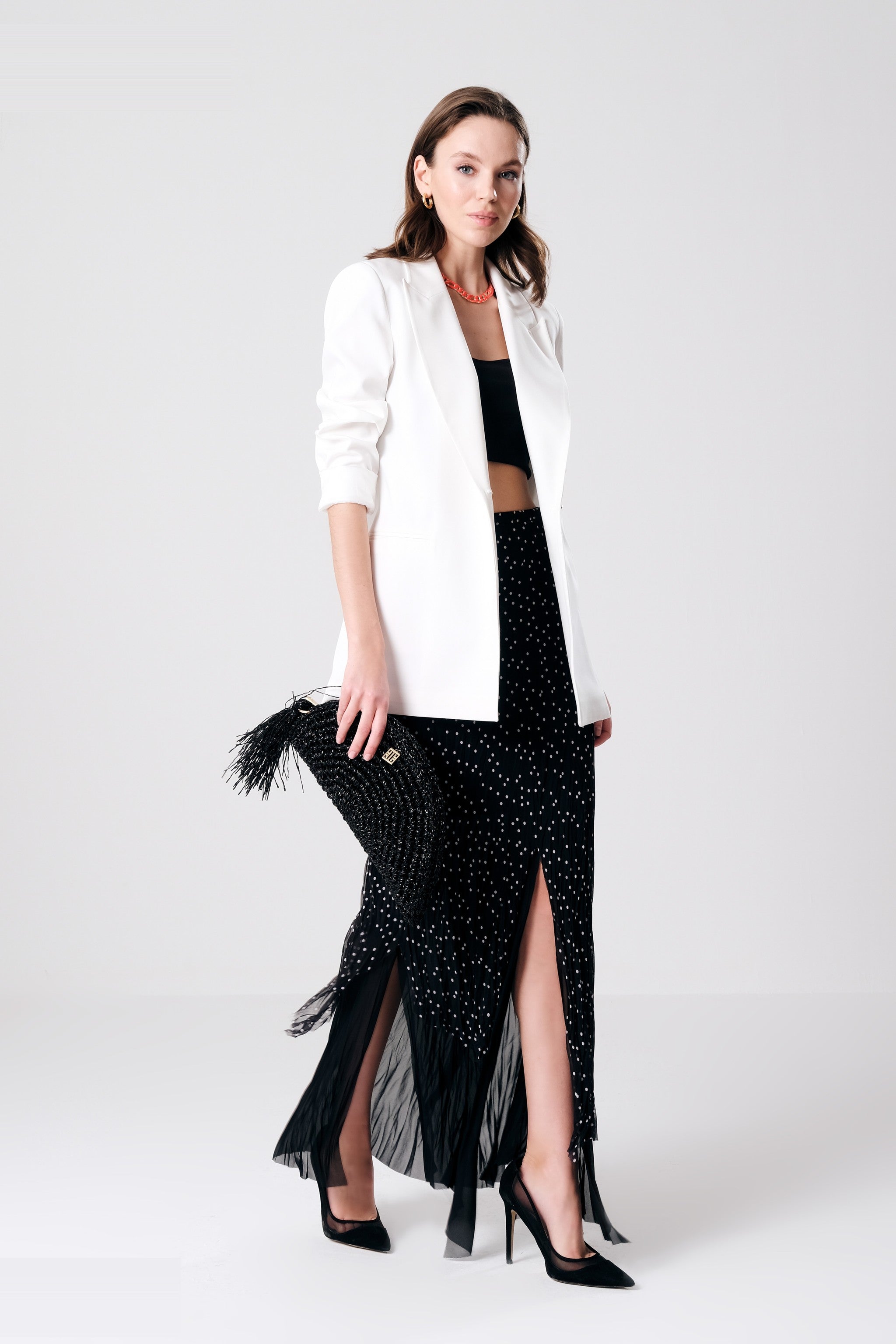 White longline blazer by Lord & Taylor Heritage styled with polka-dot skirt, full outfit view