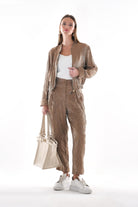 Taupe bomber jacket styled with matching trousers, full outfit view by Lord & Taylor Heritage