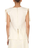 White Jil Sander wool top with back zip closure, rear view