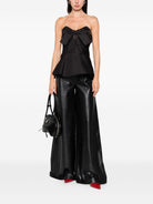 Black sleeveless blouse by Alexander McQueen, side angle