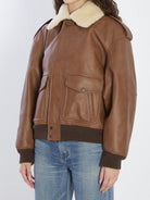 BOMBER JACKET IN HAMMERED LEATHER AND SHEARLING Saint Laurent