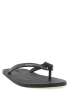 Black leather Pool flip flops by Saint Laurent, side angle view