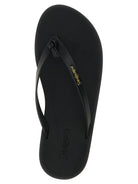 Black leather Pool flip flops by Saint Laurent, sole detail view
