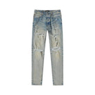 Clay indigo Amiri Thrasher Plus distressed denim jeans, front view by Amiri