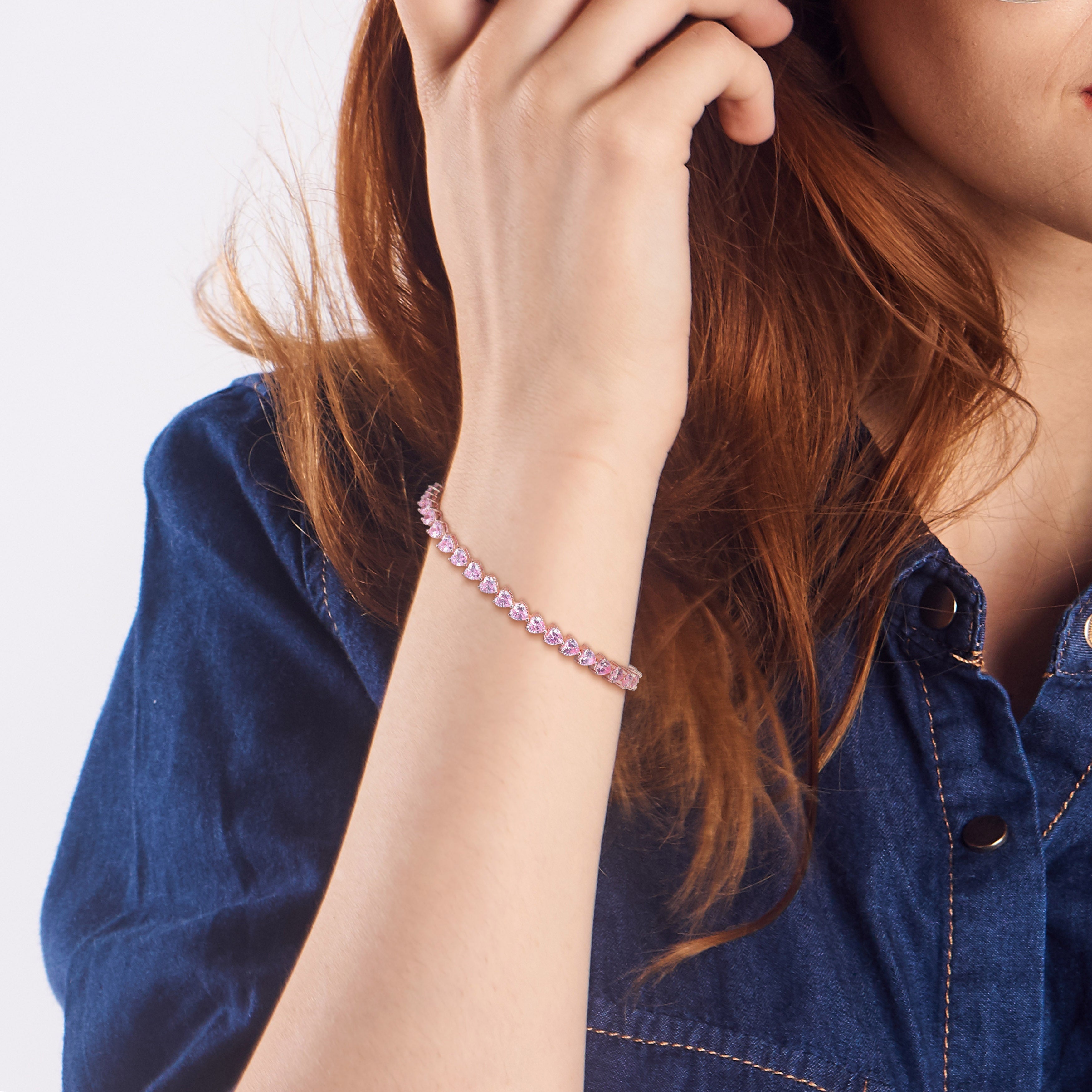 Pink sapphire tennis bracelet worn on wrist, lifestyle view by Lord & Taylor