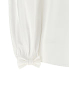White Valentino Garavani shirt, close-up of VLogo Signature embroidery on pocket