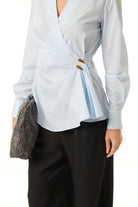 Powder blue cotton wrap blouse with buttoned cuffs by Lord & Taylor Heritage, sleeve detail view