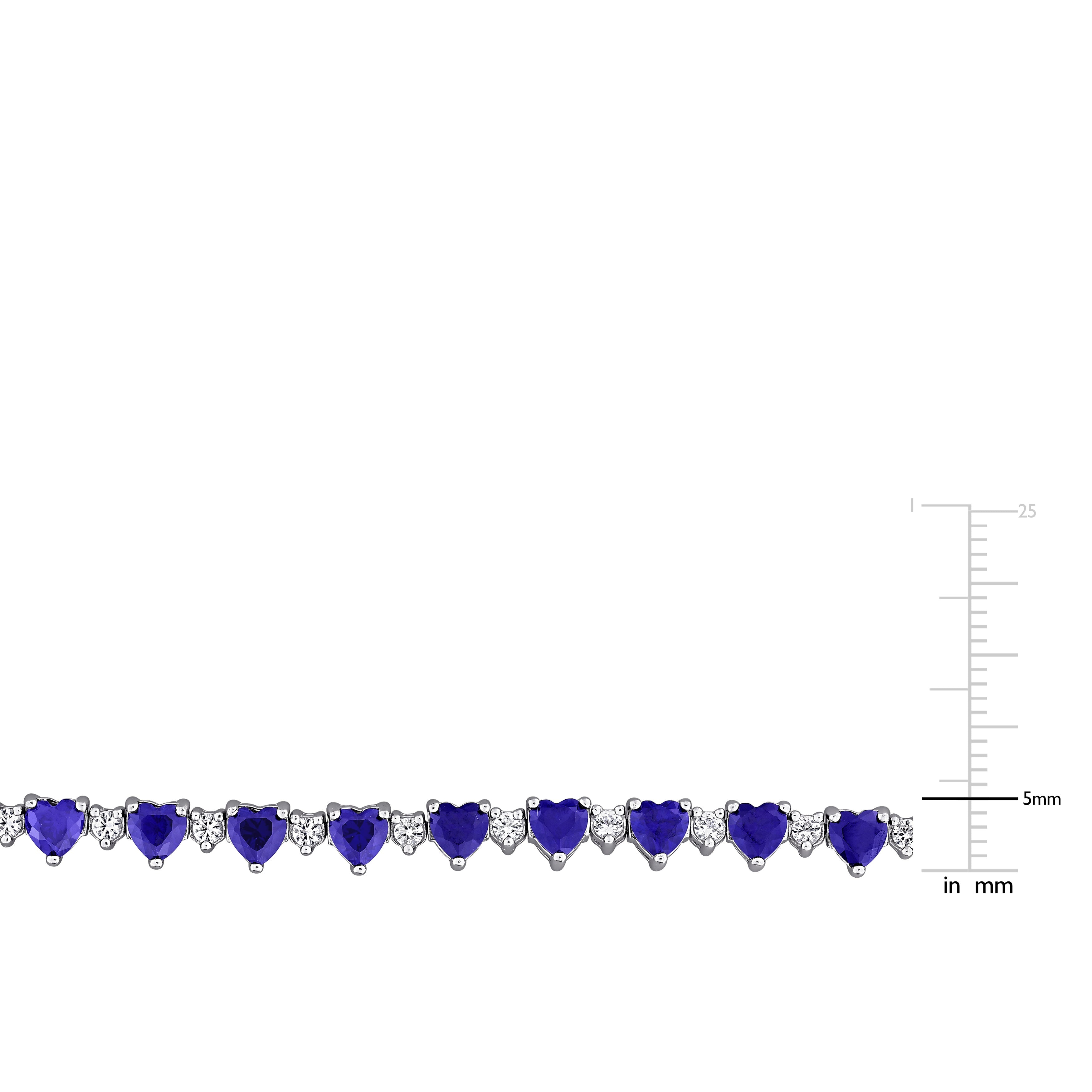 Heart-shaped created sapphire detail in polished sterling silver setting