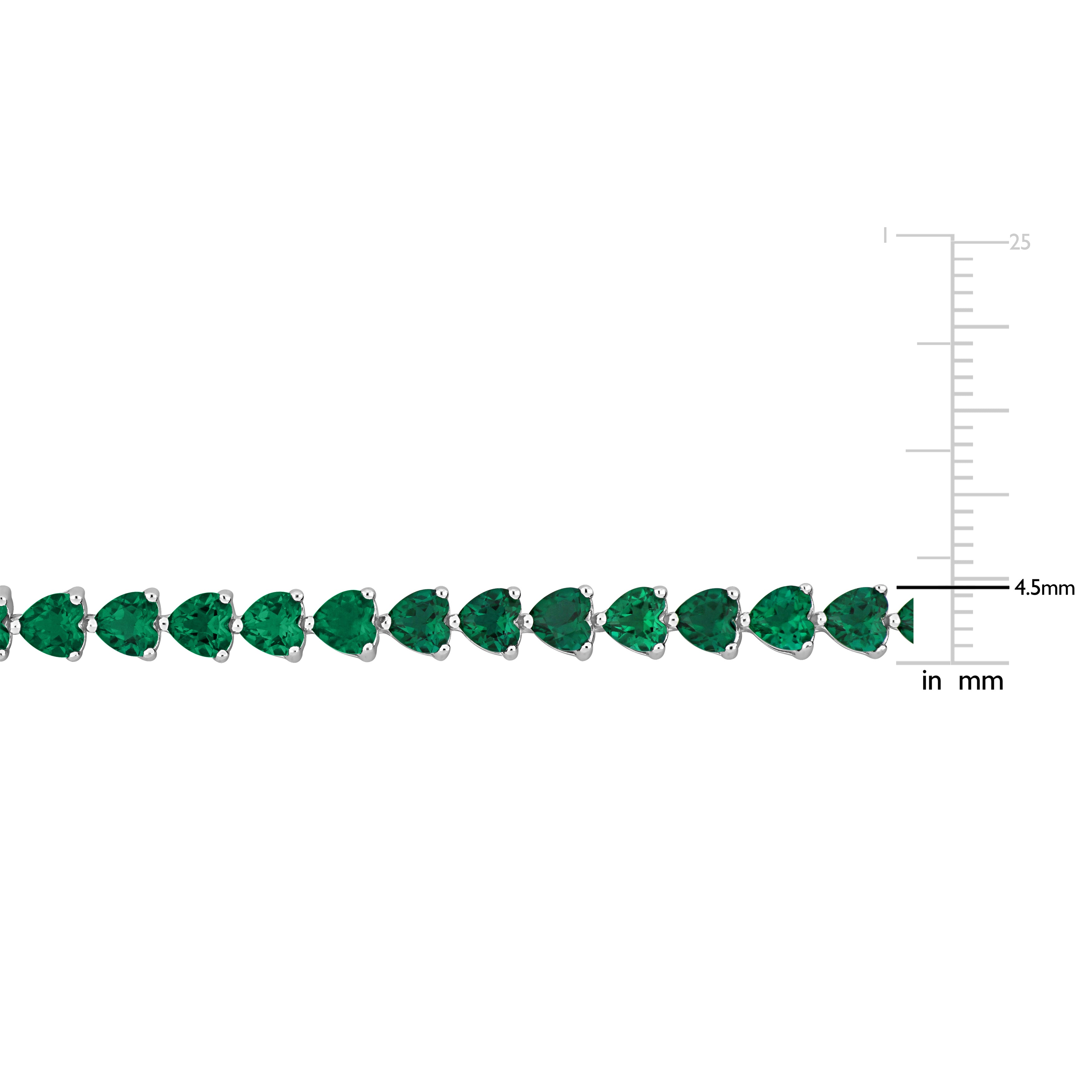 Trillion-cut created emerald gemstones in sterling silver bracelet, close-up by Lord & Taylor