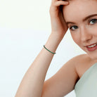 Created emerald tennis bracelet worn on wrist, lifestyle view by Lord & Taylor