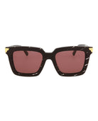 Black acetate rectangle sunglasses with gold hardware by Bottega Veneta, front view
