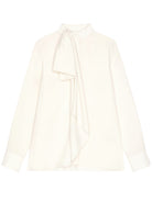 White silk blouse with bow detail at neckline by Givenchy, front view