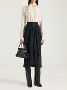 White Givenchy silk blouse with crew neckline and long sleeves, back view