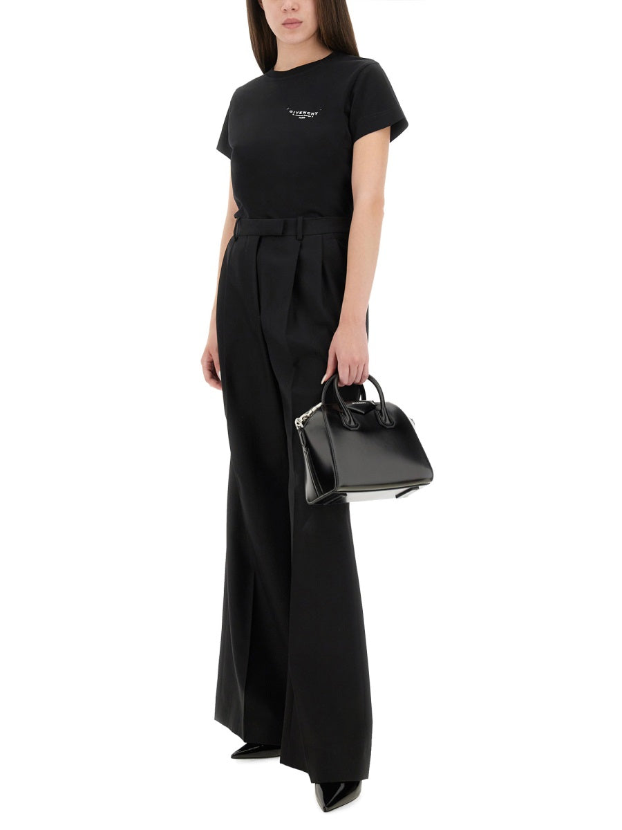 BLACK T-SHIRT WITH WHITE LOGO. Givenchy