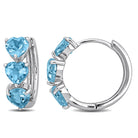 Blue topaz heart gemstone huggie hoop earrings in sterling silver, front view by Lord & Taylor