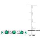 Emerald eternity ring prong setting detail by Lord & Taylor