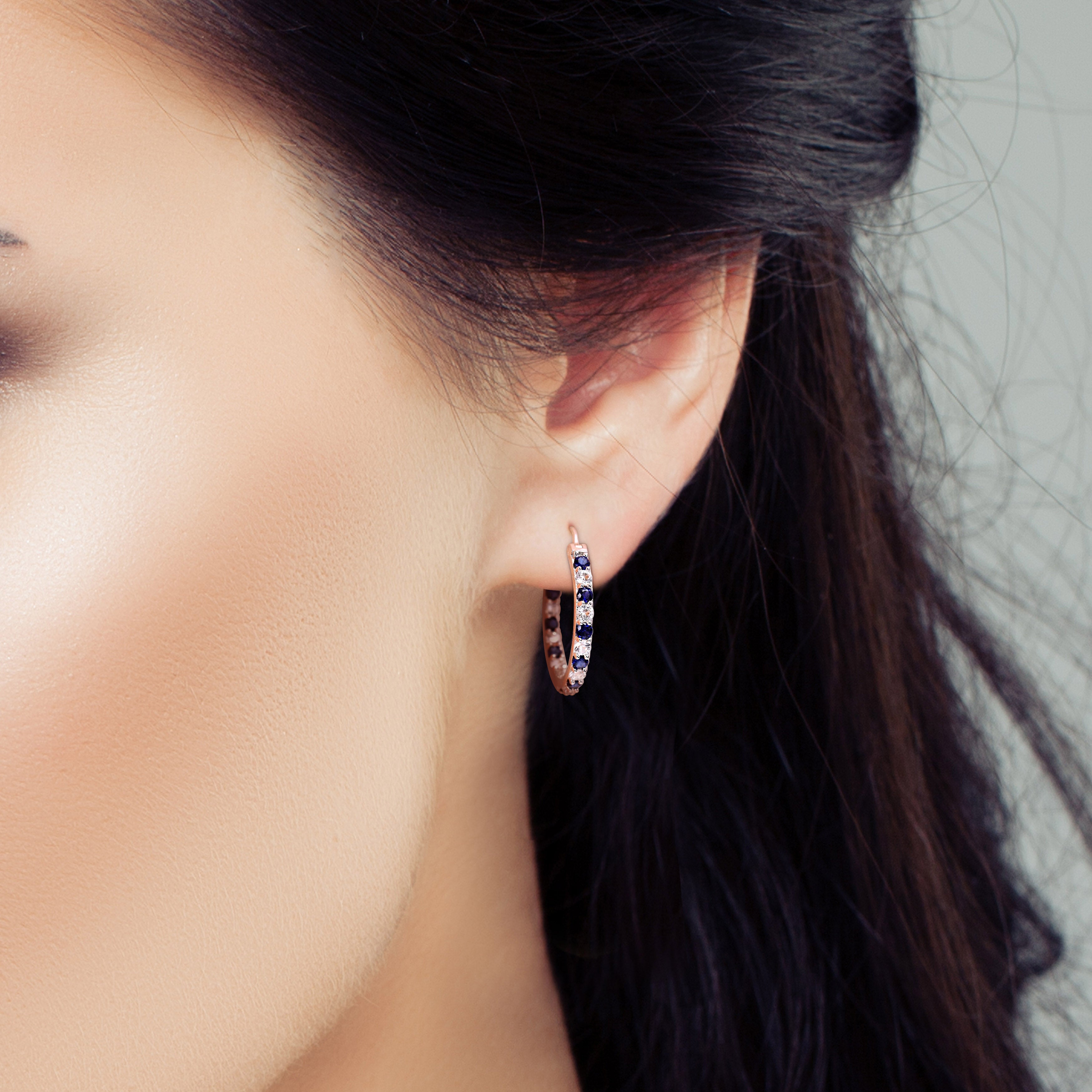 Blue sapphire and white sapphire hoop earrings worn, lifestyle view by Lord & Taylor