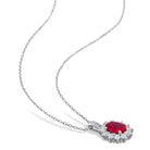 Red ruby halo pendant necklace detail showing oval gemstone and white sapphire halo by Delmar