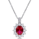 Red ruby halo pendant necklace in sterling silver, front view by Delmar