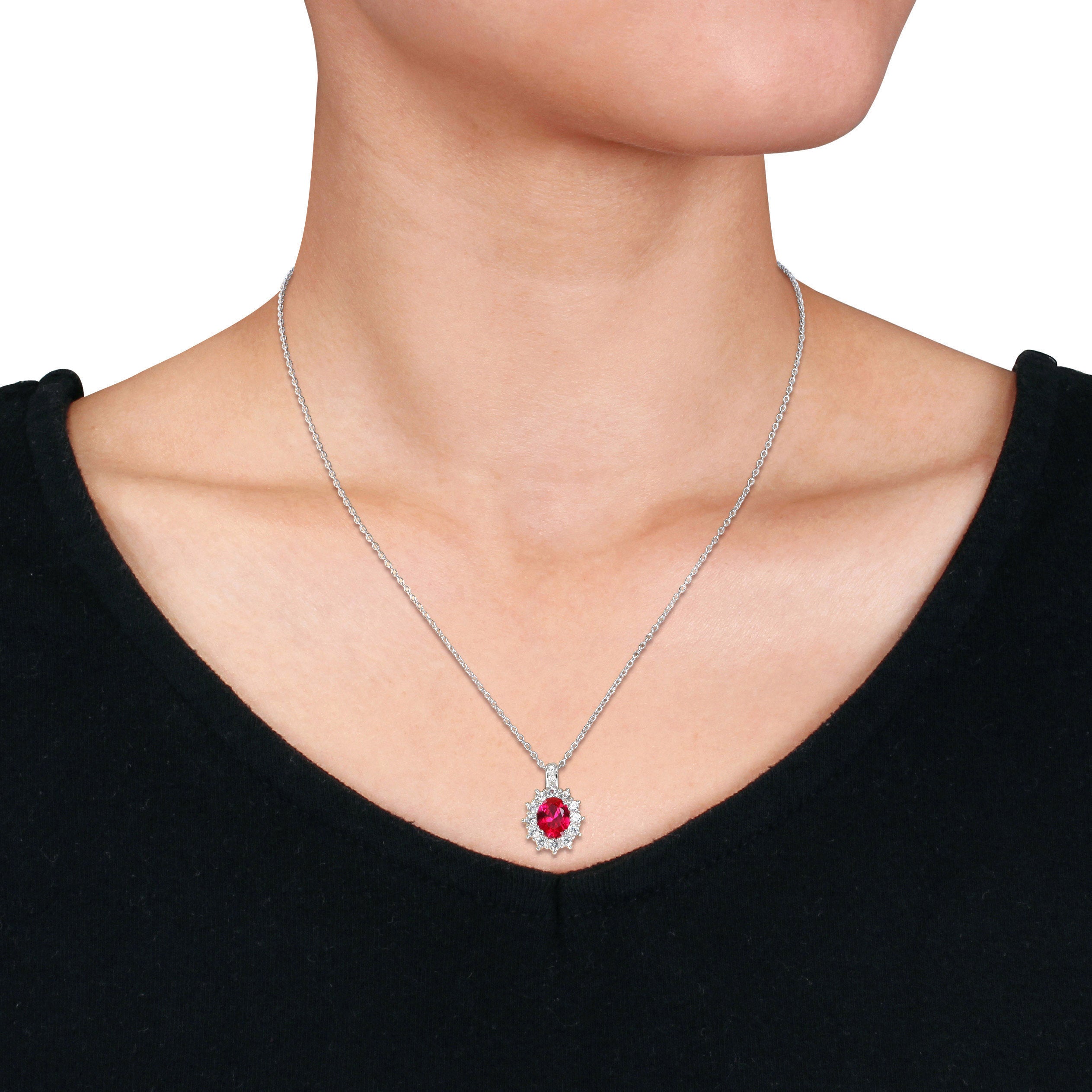 Red ruby halo pendant necklace on sterling silver cable chain, full length view by Delmar