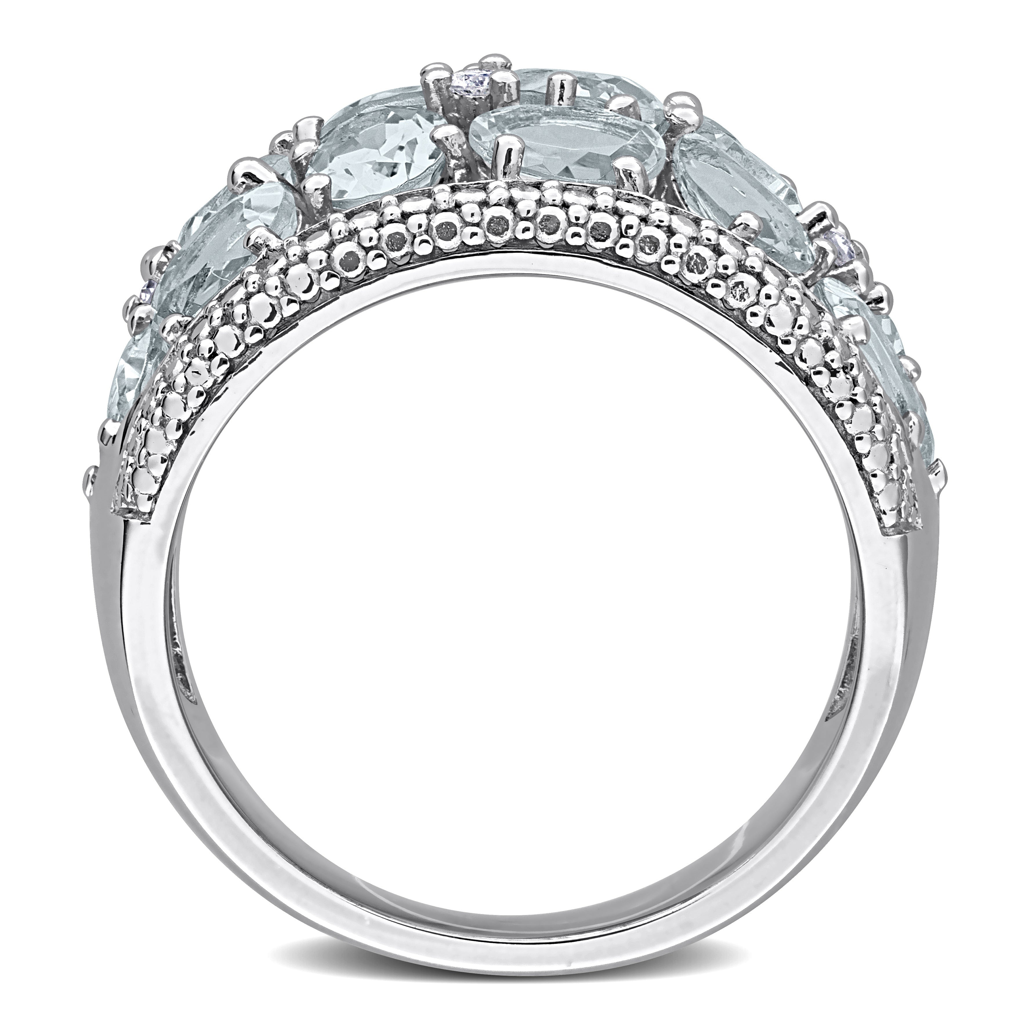 Aquamarine gemstone cocktail ring, detail view of oval and pear cut stones