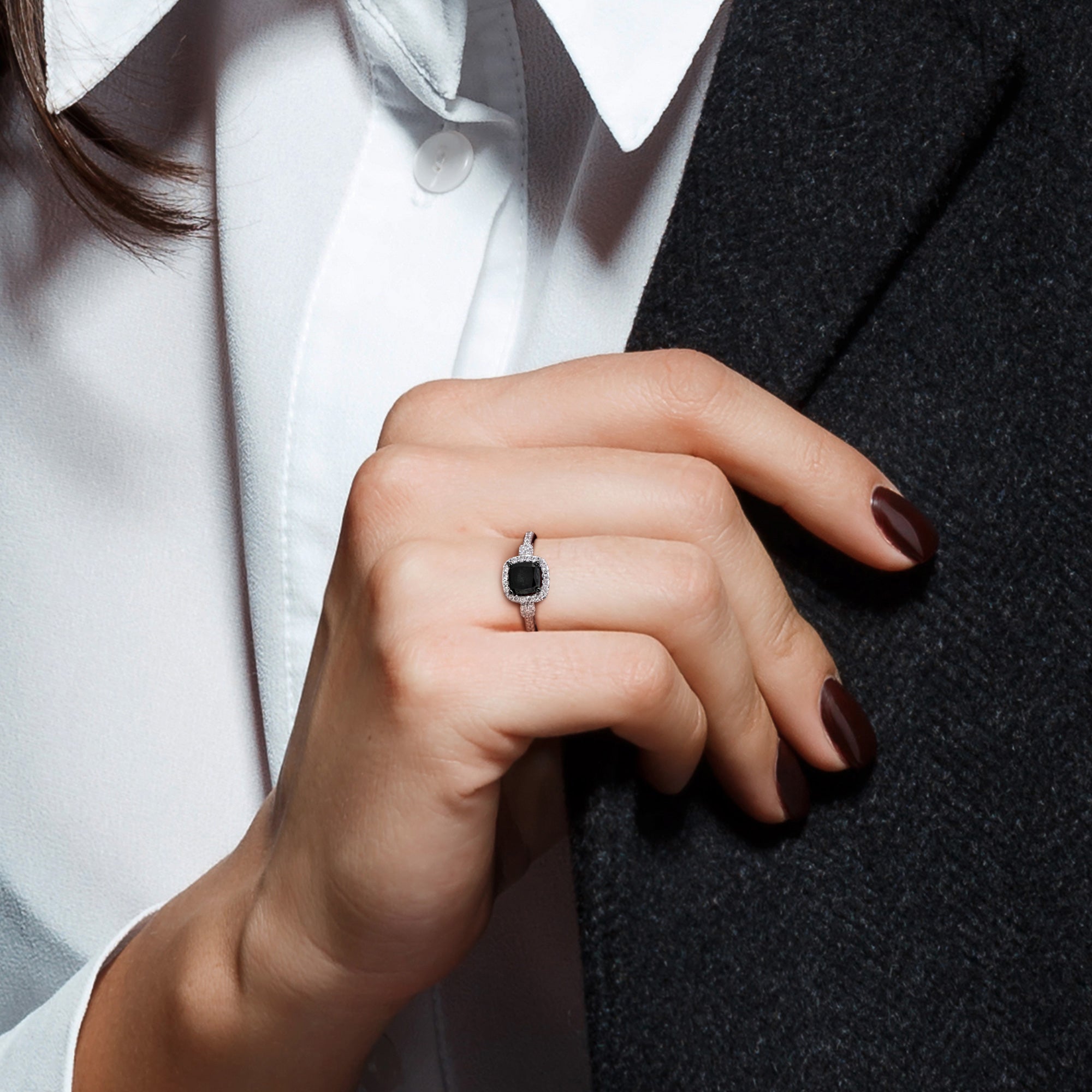 Black diamond halo ring in 14k white gold worn on hand by Lord & Taylor