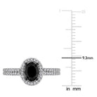 White gold oval halo engagement ring by Delmar, close-up of diamond halo detail