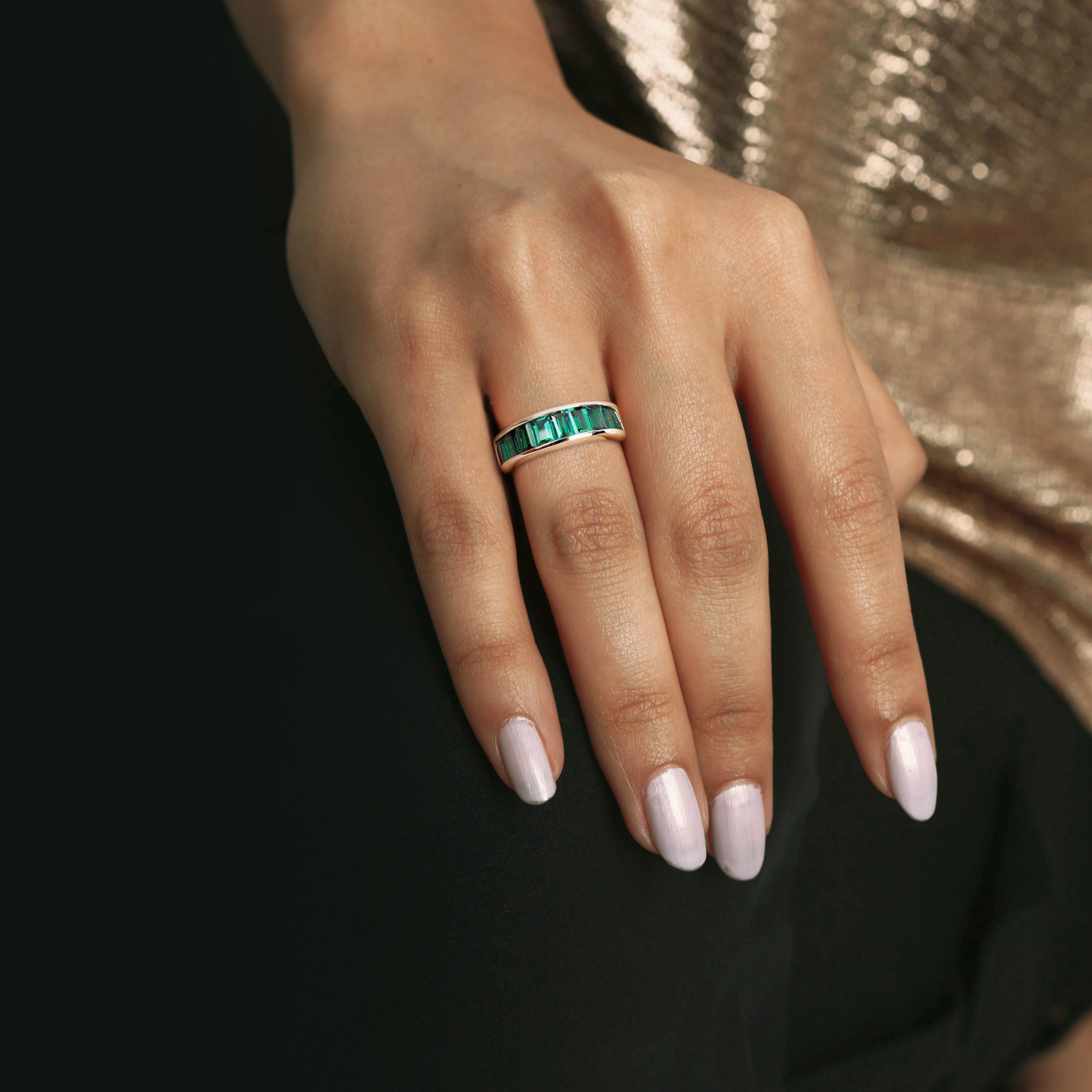Emerald yellow-plated anniversary band worn on hand