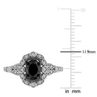 Close-up of oval black diamond center stone with pave-set white diamond halo