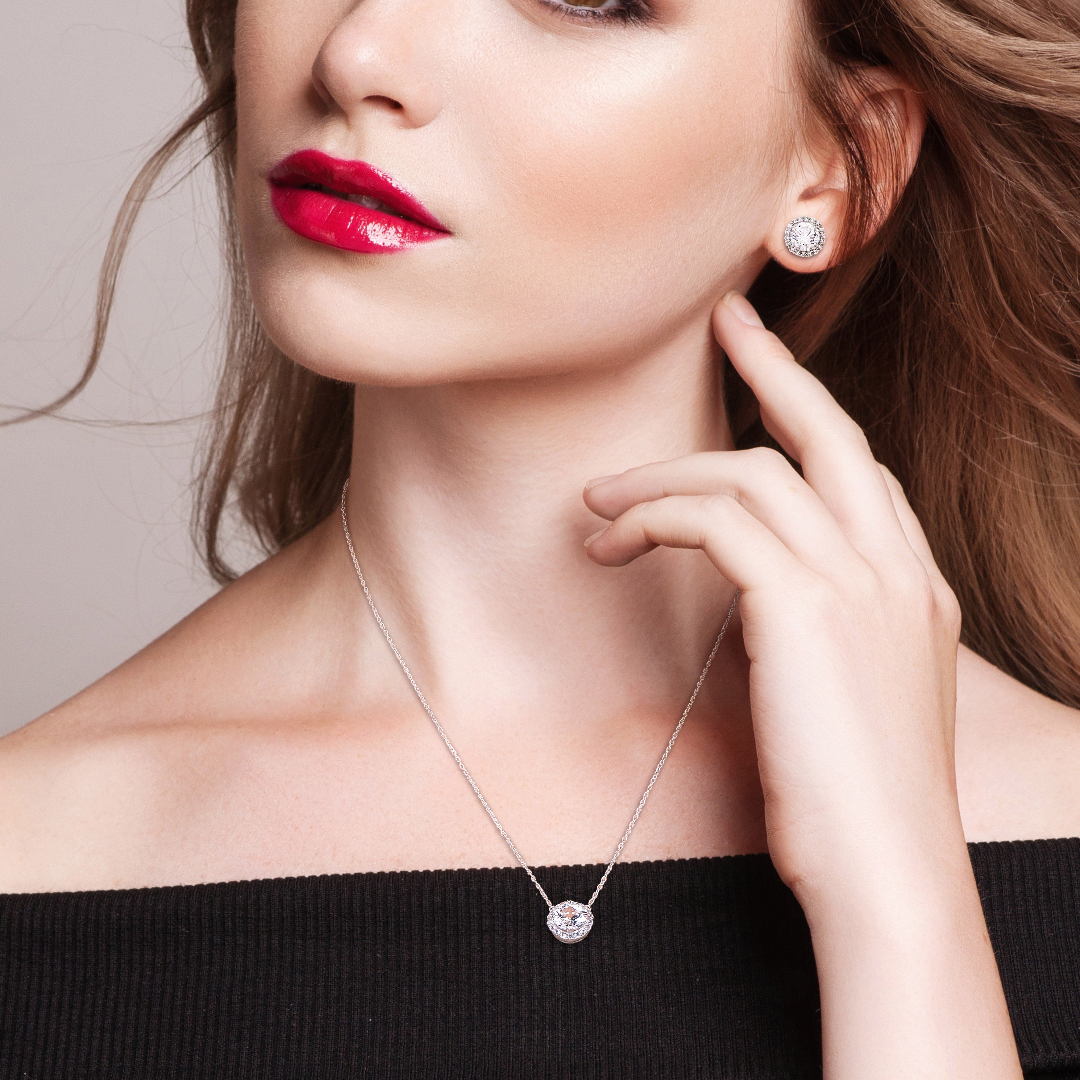 White sapphire halo necklace and earring set in sterling silver by Lord & Taylor, worn view