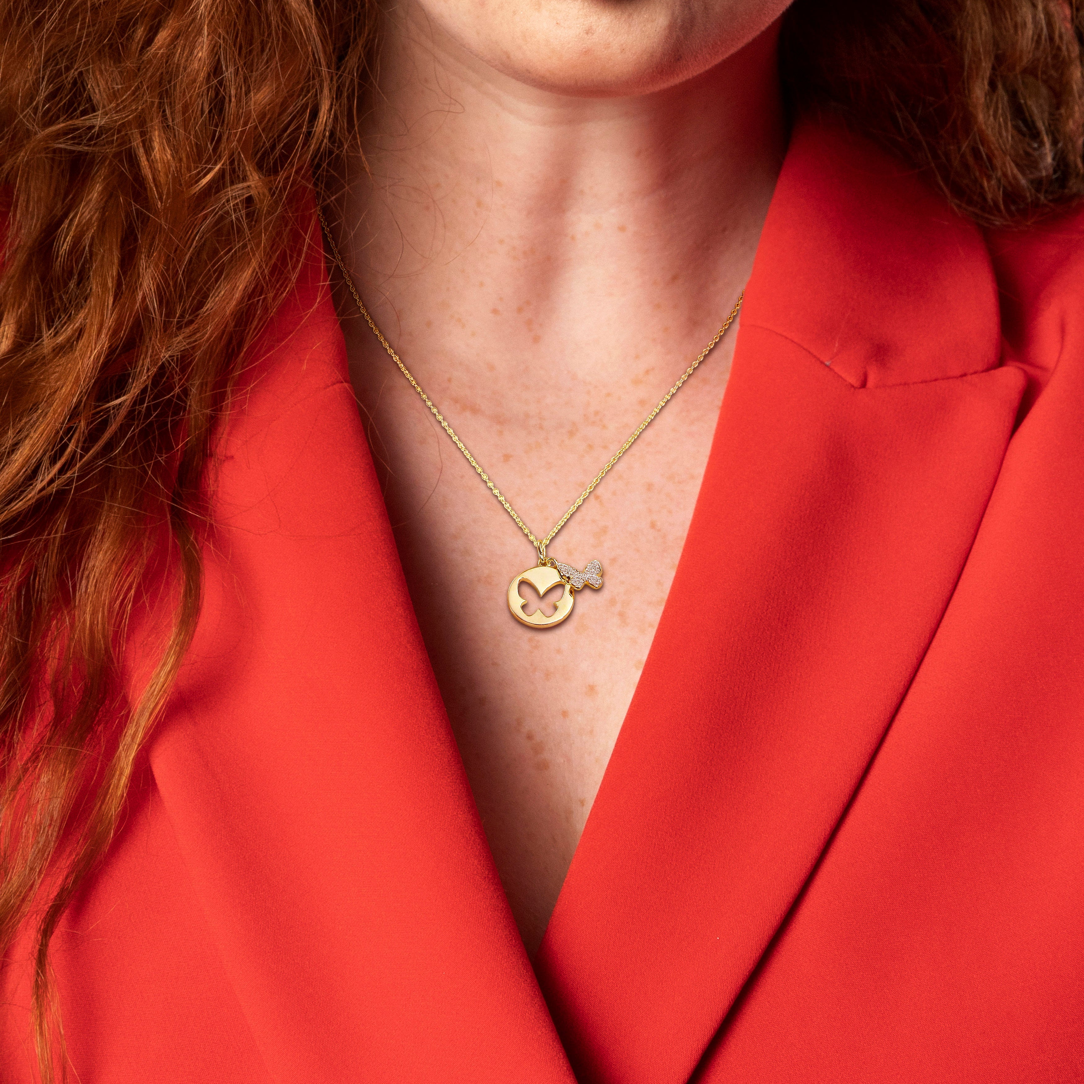 Yellow-plated sterling silver butterfly pendant necklace worn, lifestyle view