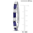 Close-up of baguette-cut blue sapphires and square-cut white sapphires on hoop earring by Lord & Taylor