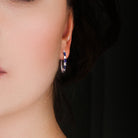 Blue sapphire sterling silver hoop earrings worn, lifestyle view by Lord & Taylor