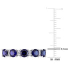 Blue created sapphire semi-eternity ring, detail of sterling silver setting by Lord & Taylor