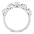 Sterling silver semi-eternity ring with white topaz, diagonal overhead view