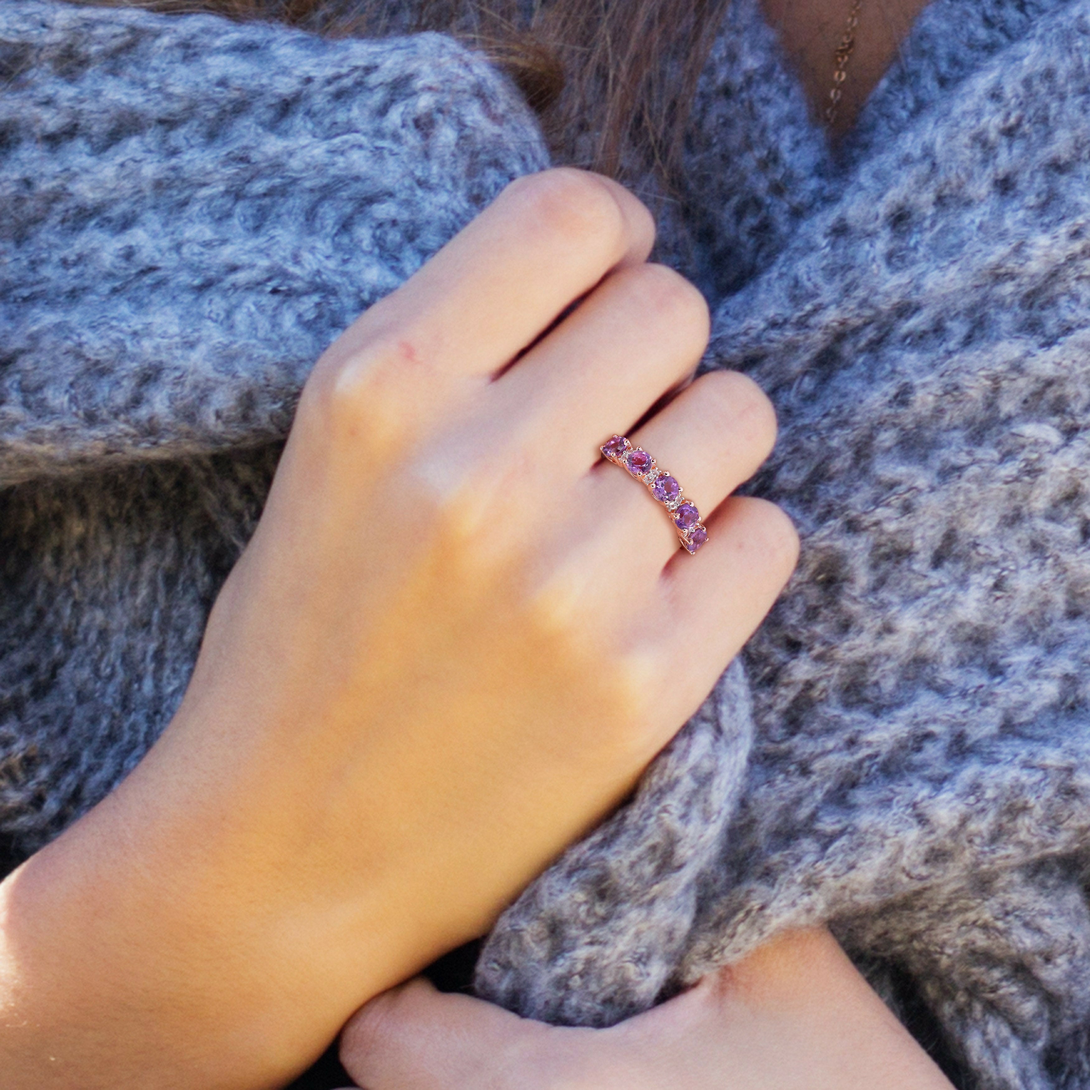 Amethyst gemstone ring in rose-plated silver, lifestyle view on hand