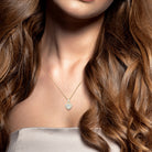 Heart pendant necklace worn on model showing 18-inch chain length by Lord & Taylor