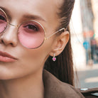 Pink sapphire heart halo earrings worn, lifestyle view by Lord & Taylor