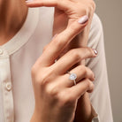 Yellow gold plated teardrop halo ring worn on hand by Lord & Taylor
