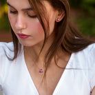 Ruby gemstone necklace and earring set worn, lifestyle view by Lord & Taylor