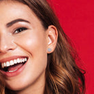 White sapphire sterling silver stud earrings worn on ear by Lord & Taylor